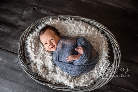 Newborn Portrait in Wicker Basket